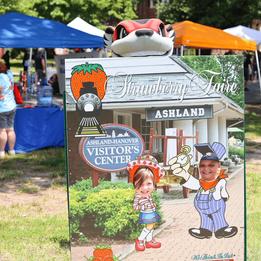two people at the selfie board at the Ashland Strawberry Faire